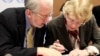 Karen Koning Abuzayd (R), member of the International Commission of Inquiry on Syria for the United Nations Human Rights Council talks to commission chairperson Paulo Pinheiro before a news conference on the presentation of their latest report at the U.N.
