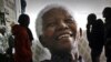 Giant photographs of former president Nelson Mandela at the Nelson Mandela Legacy Exhibition, Cape Town, June 27, 2013.