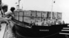 FILE - In this May 1975 file photo, the destroyer escort USS Harold E. Holt prepares to tow the United States owned cargo vessel SS Mayaguez on May 1975. When the merchant ship Mayaguez and its American crew were seized by communist forces off the coast of Cambodia in 1975, the Ford administration was determined to craft a muscular response in hope of limiting damage to U.S. prestige, according to newly declassified documents published by the State Department. (AP Photo/ U.S. Navy, File)