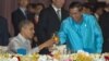 U.S. President Barack Obama, left, toasts with Cambodia's Prime Minister Hun Sen at the East Asia Summit Dinner during the East Asia Summit at the Diamond Island Convention Center in Phnom Penh, Cambodia, Monday, Nov. 19, 2012. (AP Photo/Carolyn Kaster)