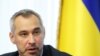 FILE - Ukraine's Prosecutor General Ruslan Ryaboshapka speaks during a news conference in Kyiv, Ukraine, Oct. 4, 2019. 