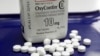 FILE: OxyContin pills are arranged for a photo at a pharmacy in Montpelier, Vt., Feb. 19, 2013.