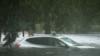 A vehicle is submerged in flood waters in Jourdan River Shores neighborhood as Hurricane Isaac passes through Kiln, Mississippi, August 29, 2012. 
